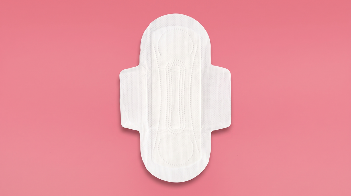 Organic cotton pad on a pink background